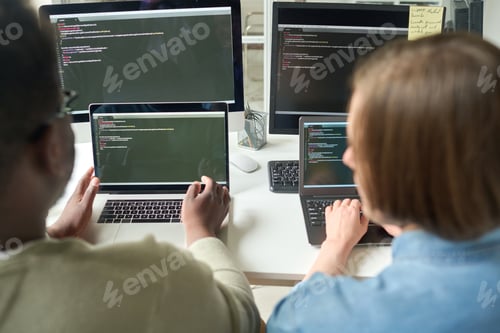 Preview: Team of developers working on new software program