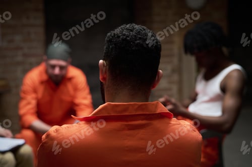 Preview: Rear View of Multiethnic Young Adult Inmates Attending Prison Support Group