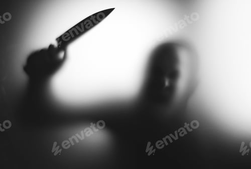 Preview: Man killer with a knife in her hand. Creepy background
