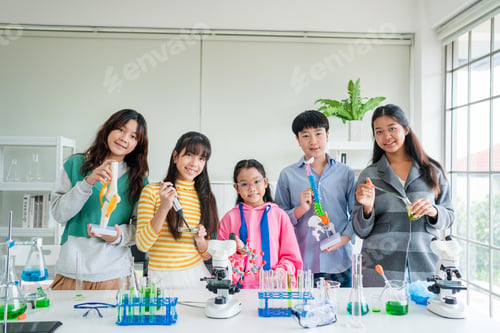 Preview: Group of young asian schoolgirls learning research and doing experiment.
