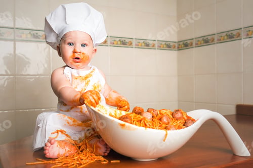 Preview: Cheerful child having fun with pasta