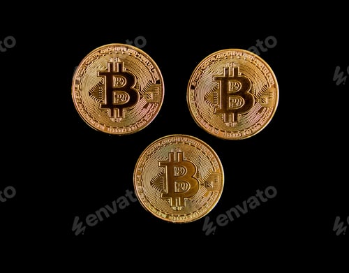 Preview: Top view of three Bitcoin coins isolated on a black background
