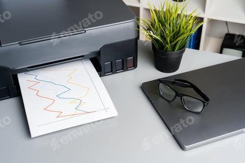Preview: New modern printer and laptop in the office on table