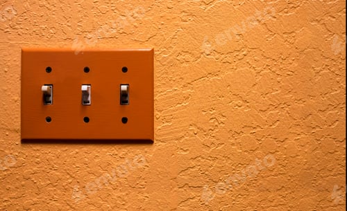 Preview: Vintage orange light switch on wall