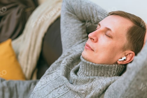 Preview: man relaxing on cozy couch