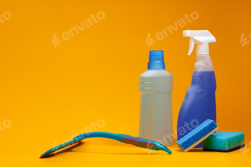 Preview: House cleaning detergent bottles on a yellow background
