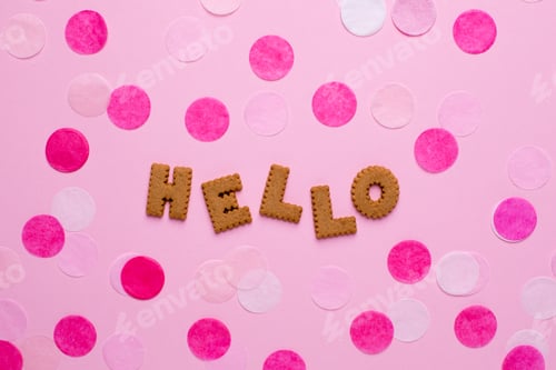 Preview: Letters cookies Hello with confetti on pink background