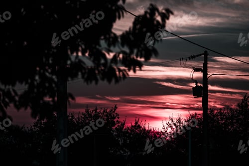 Preview: Dry field against dark sunset sky