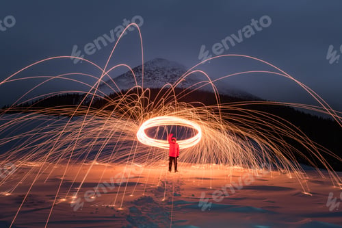 Preview: Fire show with lot of sparks in night winter mountains