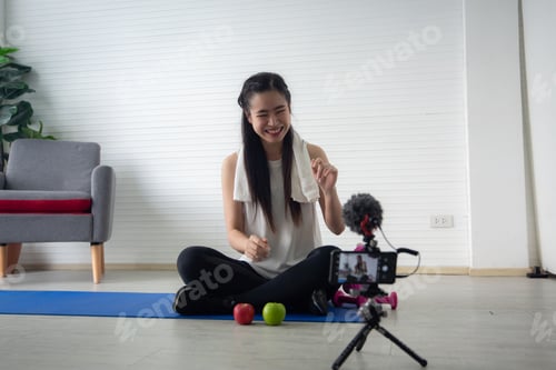 Preview: young Asian woman are live streaming about healthy food and sport health lifestyle in studio
