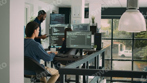 Preview: Male software developer typing machine learning app code on computer