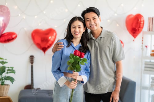 Preview: Asian couple Showing love surprise giving flowers