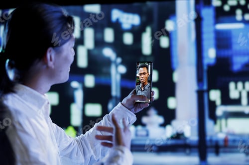 Preview: Man in city videocalls brother at night