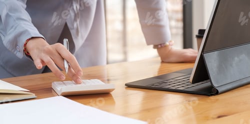 Preview: Close up of businesswoman accountant or banker making calculations.Business Financing Accounting