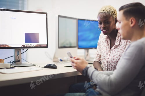Preview: Programmers cooperating at information technology company