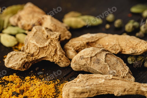 Preview: Dried ginger on dark wooden table close up
