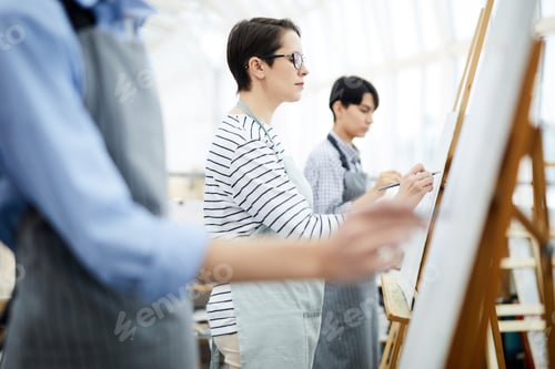 Preview: Group of Students Painting on Easel