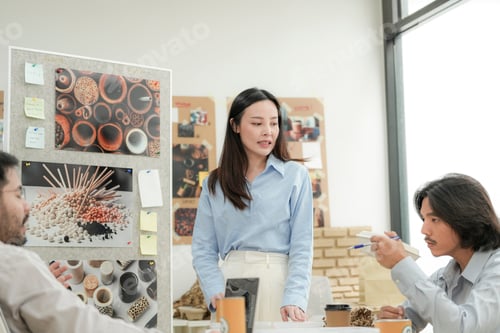 Preview: Creative team presenting eco friendly packaging ideas in a modern office.