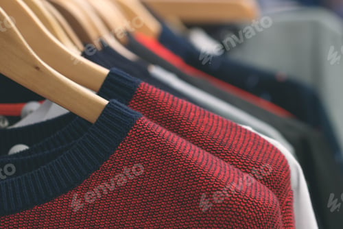 Preview: Close-up of hanging wool clothes at the store