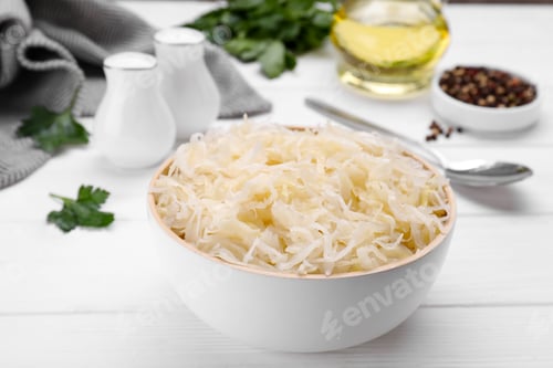 Preview: Bowl of tasty sauerkraut on white wooden table