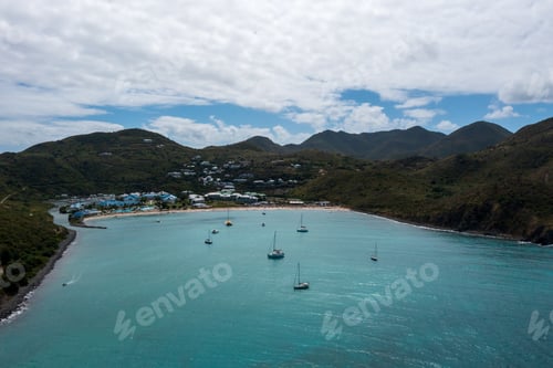 Preview: many small boats float in the water near the shore and shore