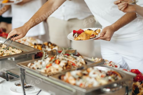Preview: Hands Taking Food from a Table at a Swedish Buffet Party