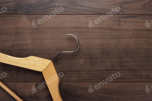 Preview: Wooden Hanger On Dark Brown Wooden Background