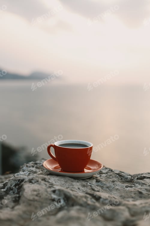 Preview: mug of coffee in nature, in the mountains