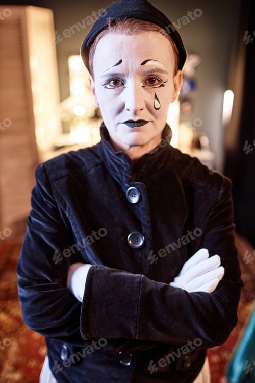 Preview: Mime Looking at Camera Standing with Arms Crossed
