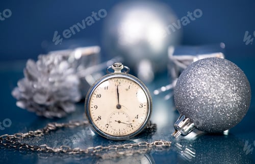 Preview: New Year's at midnight - Old clock with Christmas decoration and holiday lights