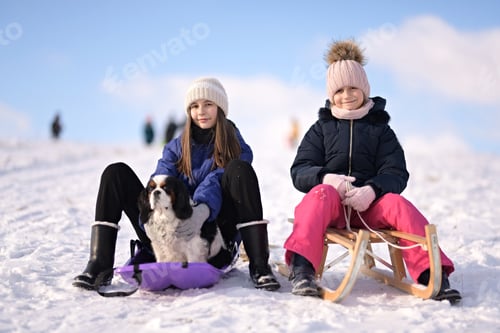Preview: Two Girls Enjoy Winter Sledding with Cute Dog