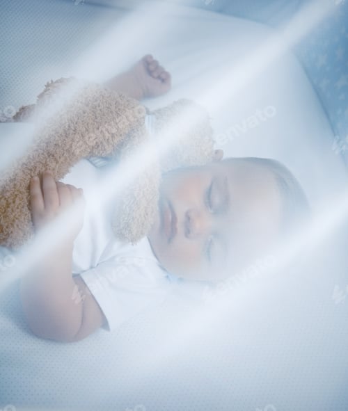 Preview: Little baby asleep in his crib