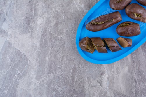 Preview: Pickled stuffed eggplants on blue plate