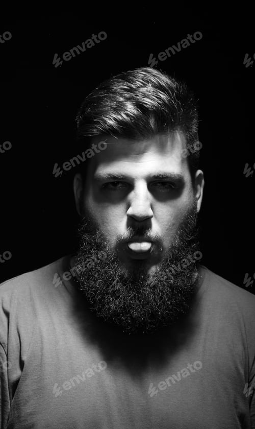 Preview: Funny Portrait Of Men With His Tongue Out. Serious Face Expression, Black Eyes.