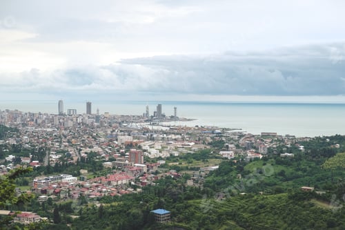 Preview: Panorama of the city at the foot of the mountain. Travel in the mountains, holidays in the mountains