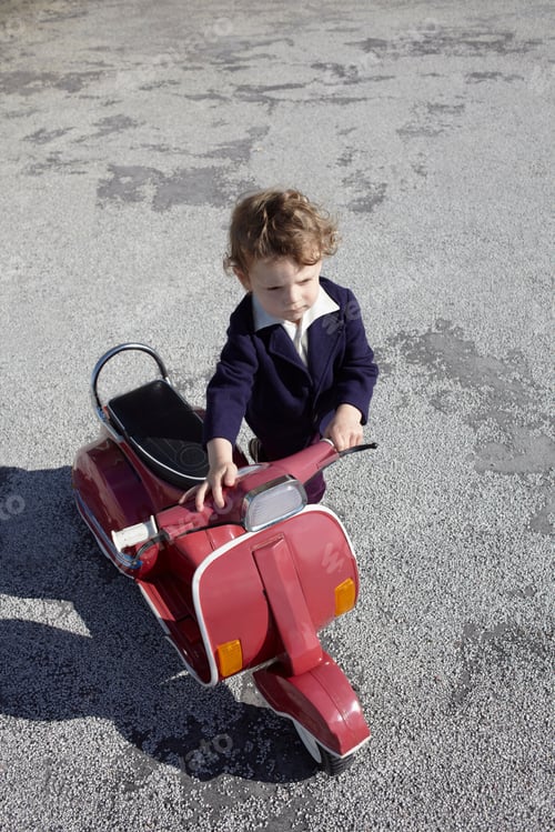 Preview: Little boy with red scooter