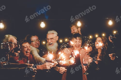 Preview: Happy family having at dinner party outdoor