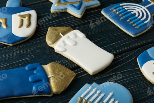 Preview: Gingerbread cookies with Jewish symbols on wooden background, close up