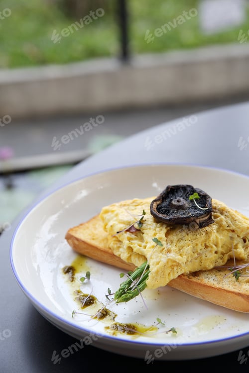 Preview: Scrambled Eggs With Bread Asparagus And Mushroom In Close Up