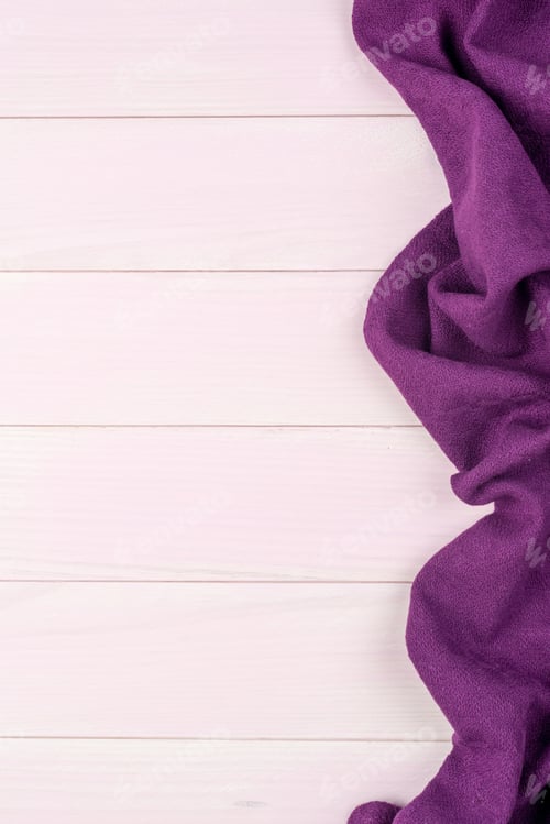 Preview: Purple towel over wooden table