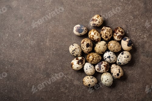 Preview: Quail eggs on stone table