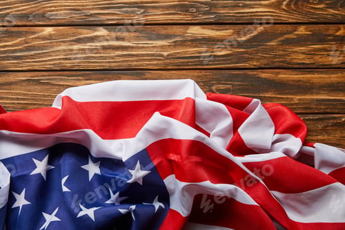 Preview: Top View of American Flag on Wooden Surface With Copy Space
