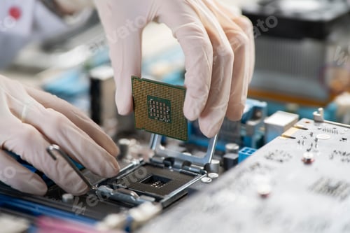 Preview: the process of Installation of processor in CPU socket, hands in gloves holding chip