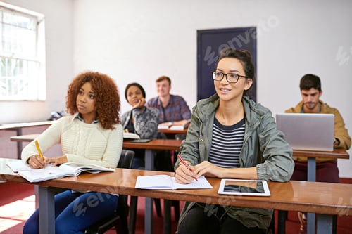 Preview: Focused on absorbing information. Shot of a university students paying attention in class.