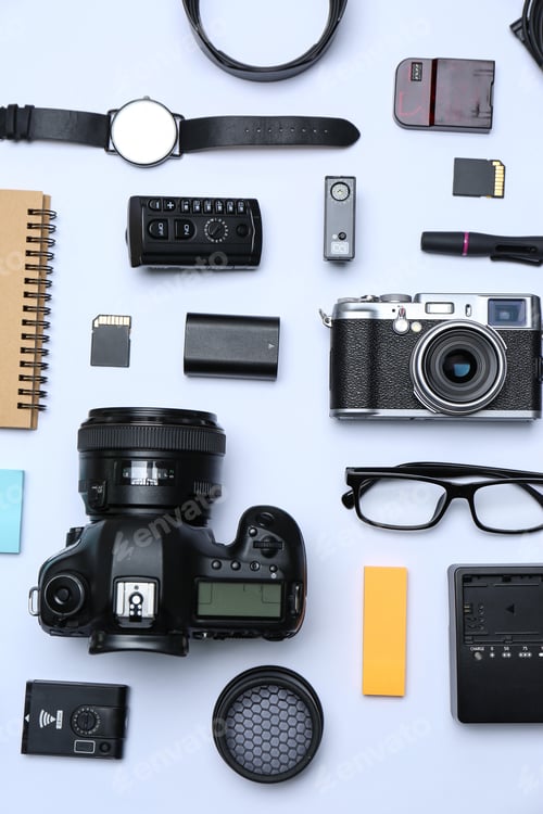 Preview: Flat lay composition with equipment for professional photographer on white background