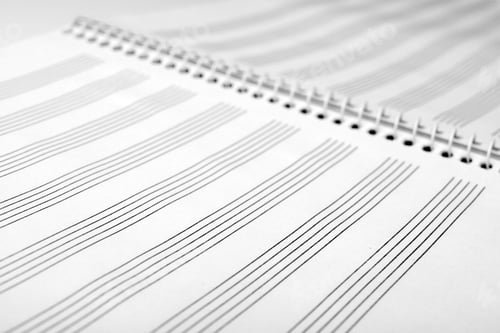 Preview: Notebook with empty staves for music notes as background, closeup