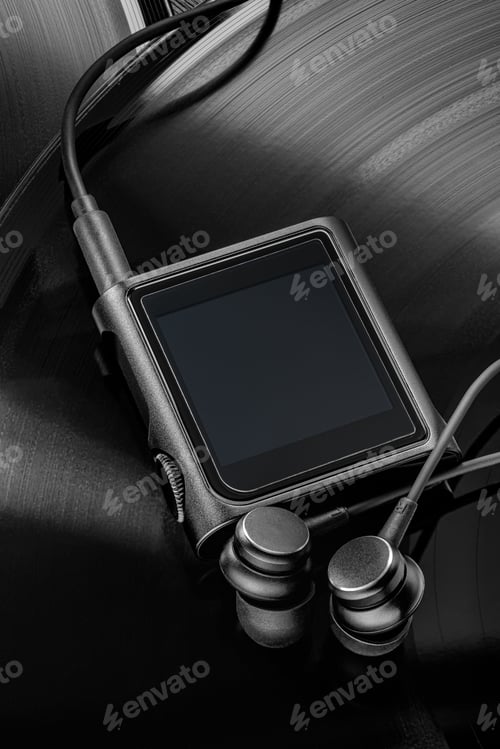Preview: Modern black MP3 music player with empty screen on vinyl records with earbuds.