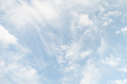 Preview: Gentle Clouds Float Across a Light Blue Sky