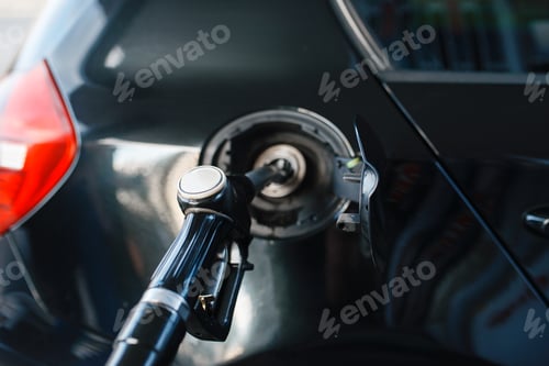 Preview: Car with gun in tank fueling on gas station