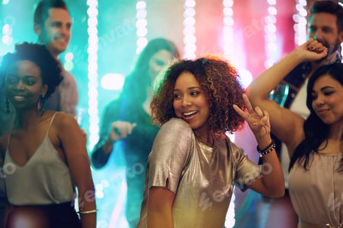 Preview: The floor is hers. Shot of a group of young people having fun in a nightclub.